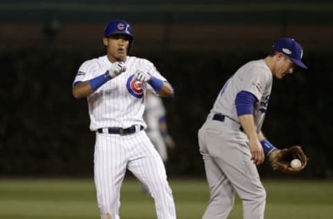 Oct 22, 2016; Chicago, IL, USA; Chicago Cubs shortstop Addison Russell (27) reacts after hitting a double against the Los Angeles Dodgers during the second inning of game six of the 2016 NLCS playoff baseball series at Wrigley Field. Mandatory Credit: Jerry Lai-USA TODAY Sports