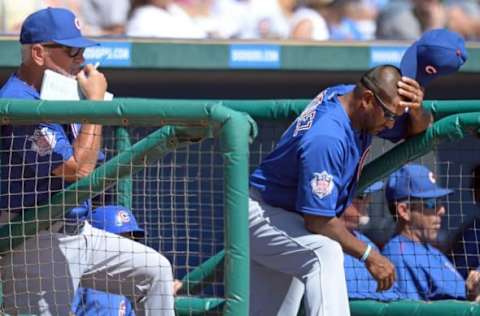 Mar 18, 2016; Phoenix, AZ, USA; Chicago Cubs manager Joe Maddon (L) and bench coach Dave Martinez (4) look on before the game against the Chicago White Sox at Camelback Ranch. Mandatory Credit: Jake Roth-USA TODAY Sports