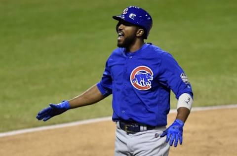 Nov 2, 2016; Cleveland, OH, USA; Chicago Cubs center fielder Dexter Fowler (24) celebrates after hitting a solo home run against the Cleveland Indians in the first inning in game seven of the 2016 World Series at Progressive Field. Mandatory Credit: David Richard-USA TODAY Sports