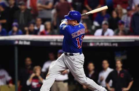 Nov 2, 2016; Cleveland, OH, USA; Chicago Cubs player Kyle Schwarber (12) hits a single against the Cleveland Indians in the 10th inning in game seven of the 2016 World Series at Progressive Field. Mandatory Credit: Ken Blaze-USA TODAY Sports