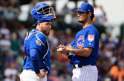 Victor Caratini, Yu Darvish (Photo by Jennifer Stewart/Getty Images)