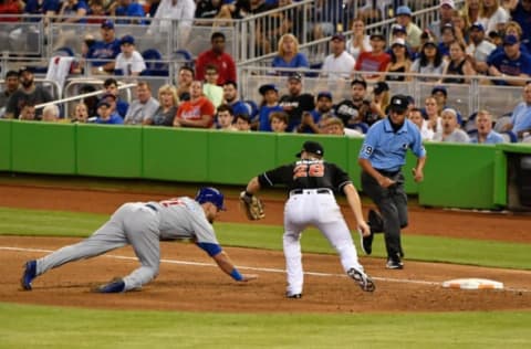 MIAMI, FL – JUNE 24: Tyler Moore #28 of the Miami Marlins tags out Mark Zagunis #21 of the Chicago Cubs in the seventh inning during the game between the Miami Marlins and the Chicago Cubs at Marlins Park on June 24, 2017 in Miami, Florida. (Photo by Mark Brown/Getty Images)