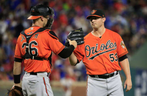 ARLINGTON, TX – JULY 29: Caleb Joseph #36 and Zach Britton #53 of the Baltimore Orioles celebrate following the game against the Texas Rangers at Globe Life Park in Arlington on July 29, 2017 in Arlington, Texas. The Orioles won 4-0. (Photo by Ron Jenkins/Getty Images)