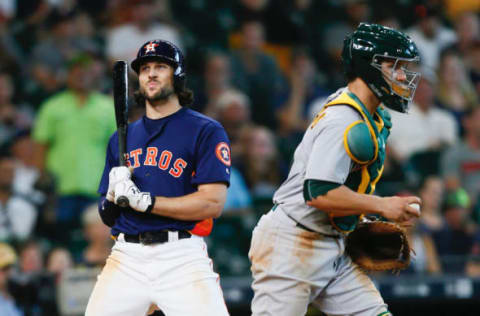 HOUSTON, TX – AUGUST 20: Jake Marisnick #6 of the Houston Astros is caught looking a called strike three to end the game as Dustin Garneau #12 of the Oakland Athletics walks away at Minute Maid Park on August 20, 2017 in Houston, Texas. (Photo by Bob Levey/Getty Images)