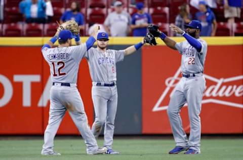 CINCINNATI, OH – AUGUST 22: Kyle Schwarber #12, Ian Happ #8 and Jason Heyward #22 of the Chicago Cubs celebrate after the final out of the13-9 win against the Cincinnati Reds at Great American Ball Park on August 22, 2017 in Cincinnati, Ohio. (Photo by Andy Lyons/Getty Images)