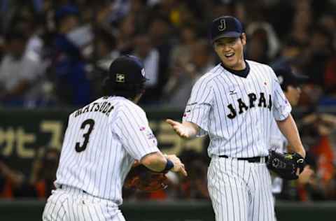 TOKYO, JAPAN – NOVEMBER 19: Starting pitcher Shohei Otani (R)