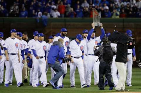 CHICAGO, IL – APRIL 10: Anthony Rizzo #44 of the Chicago Cubs leads the team onto the field with the World Series trophy before the home opening game between the Chicago Cubs and the Los Angeles Dodgers at Wrigley Field on April 10, 2017 in Chicago, Illinois. (Photo by Jonathan Daniel/Getty Images)