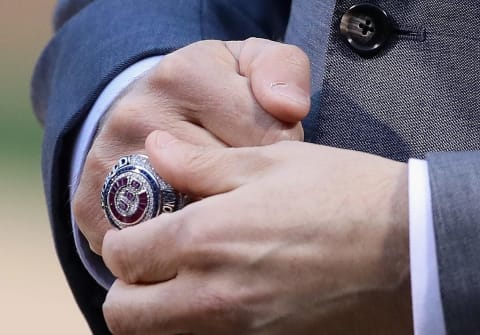 CHICAGO, IL – APRIL 12: President Theo Epstein of the Chicago Cubs adjusts his World Series Championship ring before a game against the Los Angeles Dodgers at Wrigley Field on April 12, 2017 in Chicago, Illinois. (Photo by Jonathan Daniel/Getty Images)