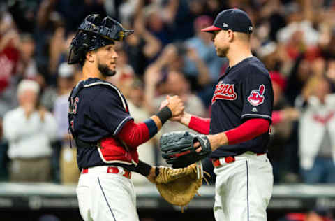 CLEVELAND, OH – SEPTEMBER 12: Catcher Yan Gomes celebrates with starting pitcher Corey Kluber