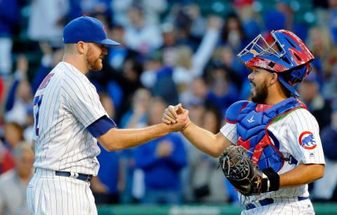 CHICAGO, IL – SEPTEMBER 30: Wade Davis #71 of the Chicago Cubs (L) and Rene Rivera #7 celebrate their win over the Cincinnati Reds at Wrigley Field on September 30, 2017 in Chicago, Illinois. The Chicago Cubs won 9-0. (Photo by Jon Durr/Getty Images)