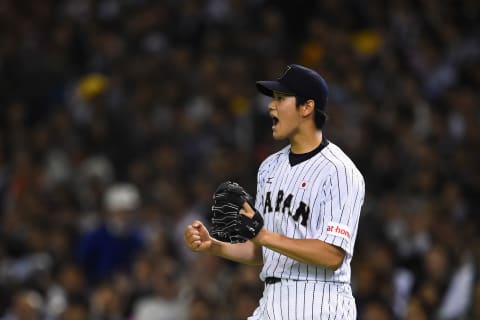 TOKYO, JAPAN – NOVEMBER 19: Starting pitcher Shohei Otani #16 of Japan reacts after the top of seventh inning during the WBSC Premier 12 semi final match between South Korea and Japan at the Tokyo Dome on November 19, 2015 in Tokyo, Japan. (Photo by Masterpress/Getty Images)