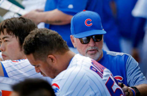 CHICAGO, IL – APRIL 16: Joe Maddon #70 of the Chicago Cubs (R) pats Hector Rondon #56 (C) on the back as Koji Uehara #19 (L) looks on after they gave up a combined three runs to the Pittsburgh Pirates in the eighth inning at Wrigley Field on April 16, 2017 in Chicago, Illinois. (Photo by Jon Durr/Getty Images)