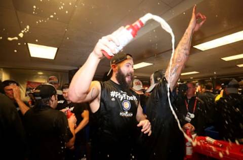 WASHINGTON, DC – OCTOBER 13: Jake Arrieta #49 of the Chicago Cubs celebrates in the clubhouse with teammates after defeating the Washington Nationals 9-8 in game five of the National League Division Series at Nationals Park on October 13, 2017 in Washington, DC. (Photo by Patrick Smith/Getty Images)