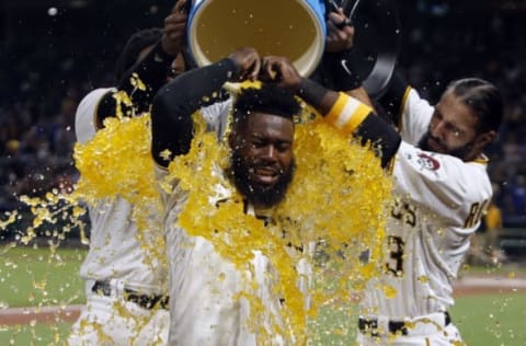 PITTSBURGH, PA – AUGUST 23: Josh Harrison #5 of the Pittsburgh Pirates celebrates with teammates after hitting a walk off home run in the tenth inning breaking up a no hitter against the Los Angeles Dodgers in the at PNC Park on August 23, 2017 in Pittsburgh, Pennsylvania. (Photo by Justin K. Aller/Getty Images)