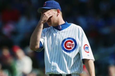 CHICAGO – APRIL 23: Kerry Wood #34 of the Chicago Cubs wipes his face during the game against the San Diego Padres at Wrigley Field on April 23, 2003, in Chicago, Illinois. The Padres defeated the Cubs 2-0. (Photo by Jonathan Daniel/Getty Images)