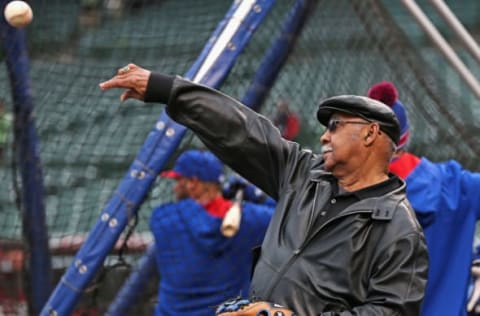 CHICAGO, IL – April 04: Former Chicago Cub and Hall of Famer Billy Williams plays catch during batting practice with a player before the home opener between the Cubs and the Philadelphia Phillies during the home opener at Wrigley Field on April 4, 2014, in Chicago, Illinois. (Photo by Jonathan Daniel/Getty Images)