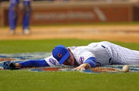 Apr 12, 2017; Chicago, IL, USA; Chicago Cubs first baseman Anthony Rizzo (44) dives for and misses a bunt off the bat of Los Angeles Dodgers starting pitcher Brandon McCarthy (not pictured) during the second inning at Wrigley Field. Mandatory Credit: Dennis Wierzbicki-USA TODAY Sports