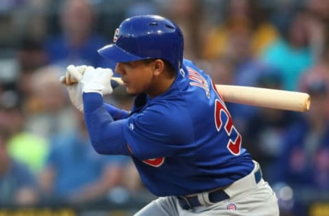 Apr 26, 2017; Pittsburgh, PA, USA; Chicago Cubs left fielder Jon Jay (30) singles against the Pittsburgh Pirates during the second inning at PNC Park. Mandatory Credit: Charles LeClaire-USA TODAY Sports