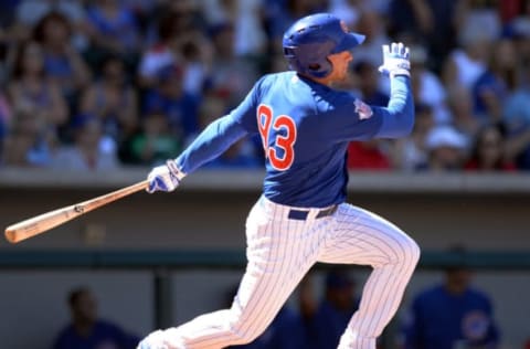 Mar 27, 2016; Mesa, AZ, USA; Chicago Cubs outfielder Mark Zagunis triples during the fourth inning against the Seattle Mariners at Sloan Park. Mandatory Credit: Jake Roth-USA TODAY Sports