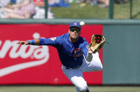 Mar 24, 2017; Mesa, AZ, USA; Chicago Cubs center fielder Albert Almora Jr. (5) dives for the ball in the third inning aginst the Cleveland Indians during a spring training game at Sloan Park. Mandatory Credit: Rick Scuteri-USA TODAY Sports