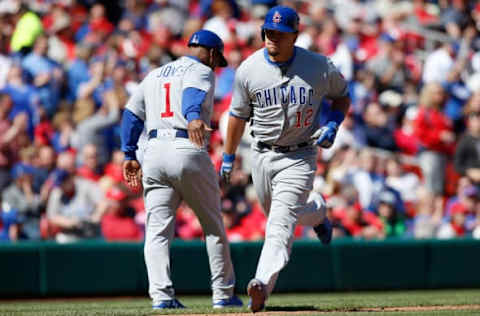 Apr 6, 2017; St. Louis, MO, USA; Chicago Cubs catcher Kyle Schwarber (12) is congratulated by third base coach Gary Jones (1) after hitting a three run home run during the seventh inning against the St. Louis Cardinals at Busch Stadium. Mandatory Credit: Scott Kane-USA TODAY Sports