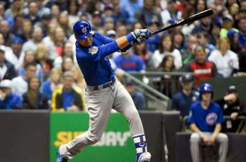 Apr 8, 2017; Milwaukee, WI, USA; Chicago Cubs center fielder Albert Almora Jr. (5) drives in a run with an infield hit in the fifth inning during the game against the Milwaukee Brewers at Miller Park. Mandatory Credit: Benny Sieu-USA TODAY Sports