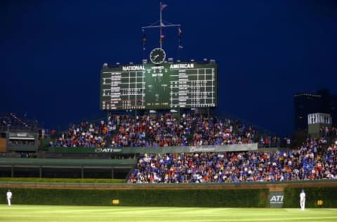 Jul 8, 2015; Chicago, IL, USA; Overall view of the crowd in the outfield grandstands and the scoreboard during the Chicago Cubs game against the St. Louis Cardinals at Wrigley Field. Mandatory Credit: Mark J. Rebilas-USA TODAY Sports