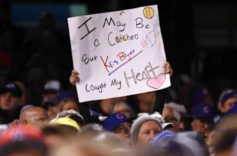 Aug 19, 2016; Denver, CO, USA; A Chicago Cubs fan holds a sign in reference to Chicago Cubs third baseman Kris Bryant (17) (not pictured) in the fifth inning against the Colorado Rockies at Coors Field. Mandatory Credit: Ron Chenoy-USA TODAY Sports