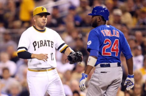 Sep 16, 2015; Pittsburgh, PA, USA; Pittsburgh Pirates first baseman Aramis Ramirez (17) tags out Chicago Cubs center fielder Dexter Fowler (24) during the fifth inning at PNC Park. Mandatory Credit: Charles LeClaire-USA TODAY Sports