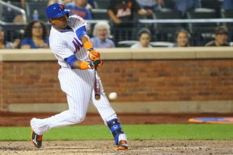 Aug 2, 2015; New York City, NY, USA; New York Mets center fielder Yoenis Cespedes (52) singles to shallow left during the third inning against the Washington Nationals at Citi Field. Mandatory Credit: Anthony Gruppuso-USA TODAY Sports