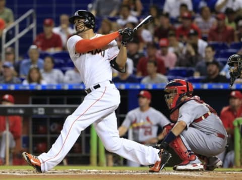 Jun 23, 2015; Miami, FL, USA; Miami Marlins right fielder Giancarlo Stanton (27) hits a two run home run in the first inning of a game against the St. Louis Cardinals at Marlins Park. Mandatory Credit: Robert Mayer-USA TODAY Sports