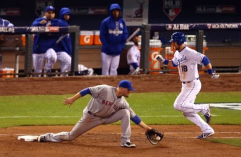 Oct 28, 2015; Kansas City, MO, USA; Kansas City Royals second baseman Ben Zobrist (18) is forced out by New York Mets first baseman Lucas Duda (21) in the 7th inning in game two of the 2015 World Series at Kauffman Stadium. Mandatory Credit: Jeff Curry-USA TODAY Sports