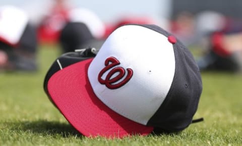 Feb 24, 2015; Viera, FL, USA; A Washington Nationals baseball cap lies on the field during spring training workouts at Space Coast Stadium. Mandatory Credit: Reinhold Matay-USA TODAY Sports