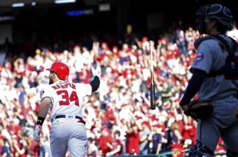 Apr 24, 2016; Washington, DC, USA; Washington Nationals right fielder Bryce Harper (34) tips his bat after hitting a pinch-hit game-tying home run against the Minnesota Twins in the bottom of the ninth inning at Nationals Park. The Nationals won 5-4 in sixteen innings. Mandatory Credit: Geoff Burke-USA TODAY Sports