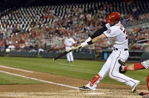 Apr 26, 2016; Washington, DC, USA; Washington Nationals right fielder Bryce Harper (34) hits a rbi single during the fifth inning against the Philadelphia Phillies at Nationals Park. Mandatory Credit: Tommy Gilligan-USA TODAY Sports