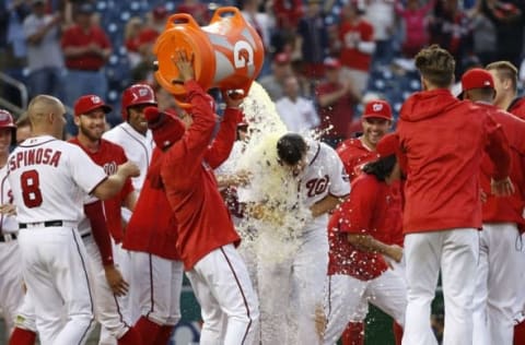 Apr 24, 2016; Washington, DC, USA; Washington Nationals center fielder Chris Heisey (14) gets a bucket of Gatorade dumped on him by teammates after hitting a walk-off home run against the Minnesota Twins in the sixteenth inning at Nationals Park. The National won 5-4 in sixteen innings. Mandatory Credit: Geoff Burke-USA TODAY Sports