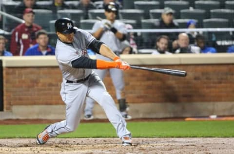 Apr 11, 2016; New York City, NY, USA; Miami Marlins right fielder Giancarlo Stanton (27) hits a two run home run to left center during the second inning against the New York Mets at Citi Field. Mandatory Credit: Anthony Gruppuso-USA TODAY Sports