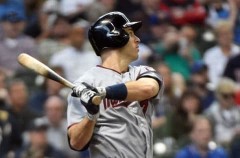 Apr 21, 2016; Milwaukee, WI, USA; Minnesota Twins first baseman Joe Mauer (7) hits a double in the fifth inning during the game against the Milwaukee Brewers at Miller Park. Mandatory Credit: Benny Sieu-USA TODAY Sports