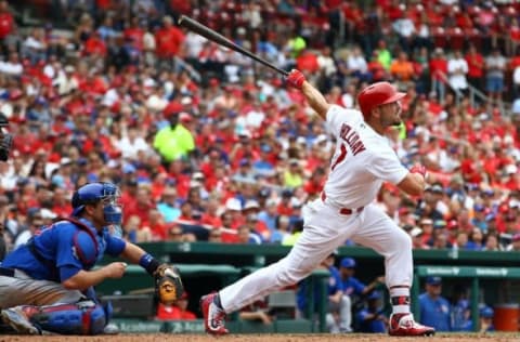 May 25, 2016; St. Louis, MO, USA; St. Louis Cardinals left fielder Matt Holliday (7) hits a three-run home run off of Chicago Cubs relief pitcher Adam Warren (not pictured) during the sixth inning at Busch Stadium. Mandatory Credit: Billy Hurst-USA TODAY Sports