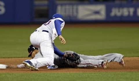 May 17, 2016; New York City, NY, USA; Washington Nationals center fielder Ben Revere (9) is tagged out by New York Mets second baseman Neil Walker (20) while attempting to steal second base during the sixth inning at Citi Field. Mandatory Credit: Adam Hunger-USA TODAY Sports