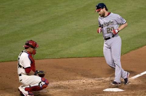 May 30, 2016; Philadelphia, PA, USA; Washington Nationals second baseman Daniel Murphy (20) touches the plate in front of Philadelphia Phillies catcher Carlos Ruiz (51) after hitting a solo home run during the fourth inning at Citizens Bank Park. Mandatory Credit: Bill Streicher-USA TODAY Sports