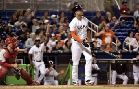 May 6, 2016; Miami, FL, USA; Miami Marlins right fielder Giancarlo Stanton (27) watches as he hits a two run homer during the eighth inning against the Philadelphia Phillies at Marlins Park. The Marlins won 6-4. Mandatory Credit: Steve Mitchell-USA TODAY Sports