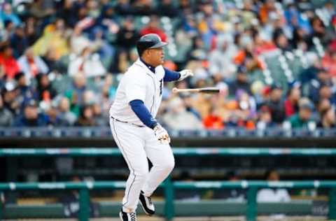 Apr 28, 2016; Detroit, MI, USA; Detroit Tigers first baseman Miguel Cabrera (24) hits an RBI single in the third inning against the Oakland Athletics at Comerica Park. Mandatory Credit: Rick Osentoski-USA TODAY Sports