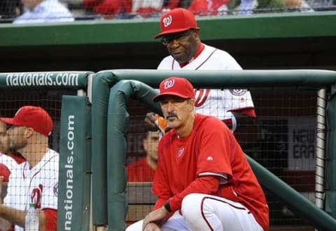 May 9, 2016; Washington, DC, USA; Washington Nationals pitching coach Mike Maddux (51) and manager Dusty Baker (12) look on against the Detroit Tigers during the first inning at Nationals Park. Mandatory Credit: Brad Mills-USA TODAY Sports