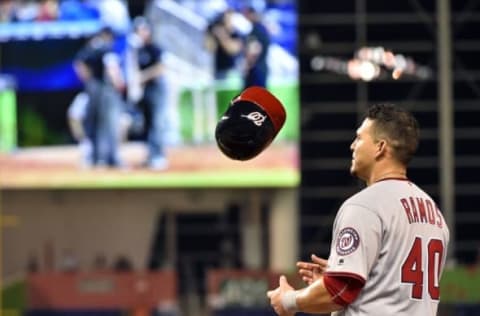 May 20, 2016; Miami, FL, USA; Washington Nationals catcher Wilson Ramos (40) stands on first base as the previous play is under further review during the ninth inning against the Miami Marlins at Marlins Park. The Nationals won 4-1. Mandatory Credit: Steve Mitchell-USA TODAY Sports