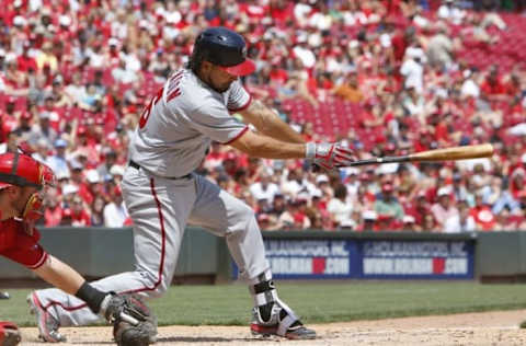 Jun 5, 2016; Cincinnati, OH, USA; Washington Nationals third baseman Anthony Rendon grounds in to a fielders choice scoring two runs against the Cincinnati Reds during the fifth inning at Great American Ball Park. Mandatory Credit: David Kohl-USA TODAY Sports