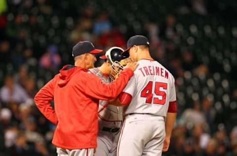 Jun 7, 2016; Chicago, IL, USA; Washington Nationals relief pitcher Blake Treinen (45) and catcher Wilson Ramos (40) meet at the mound during the seventh inning against the Chicago White Sox at U.S. Cellular Field. Mandatory Credit: Caylor Arnold-USA TODAY Sports