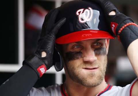 Jun 4, 2016; Cincinnati, OH, USA; Washington Nationals right fielder Bryce Harper prepares in the dugout at the beginning of a game against the Cincinnati Reds during the first inning at Great American Ball Park. Mandatory Credit: David Kohl-USA TODAY Sports