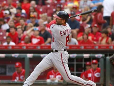 Jun 4, 2016; Cincinnati, OH, USA; Washington Nationals shortstop Danny Espinosa hits a solo home run against the Cincinnati Reds during the eighth inning at Great American Ball Park. Mandatory Credit: David Kohl-USA TODAY Sports