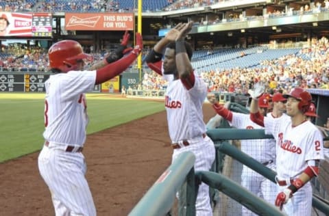 Jun 7, 2016; Philadelphia, PA, USA; Philadelphia Phillies shortstop Freddy Galvis (13) celebrates with center fielder Odubel Herrera (37) after scoring a run during the first inning against the Chicago Cubs at Citizens Bank Park. Mandatory Credit: Eric Hartline-USA TODAY Sports